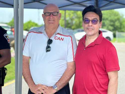 Mayor Kevin Ashe with PaxUnity Executive Director Salim Beg at Canada Day 2026 Ajax Ontario